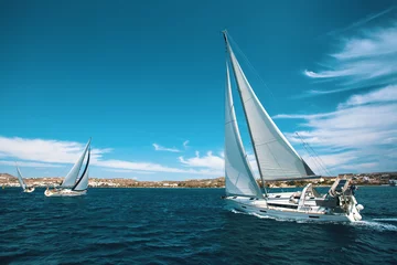 Wandaufkleber Luxury yachts at regatta. Sailing through the waves at the Aegean Sea. © De Visu