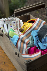 Spool of Yarn and Fabric Ribbons in Wooden Toolbox