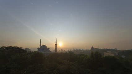 Fototapeta premium a beautiful sunrise or sunset view of The Federal Territory Mosque in Kuala Lumpur, Malaysia