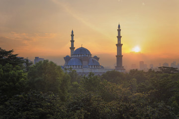 Fototapeta na wymiar a beautiful sunrise or sunset view of The Federal Territory Mosque in Kuala Lumpur, Malaysia