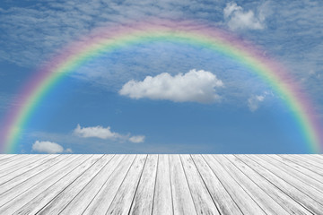 Wood terrace and Blue sky with rainbow
