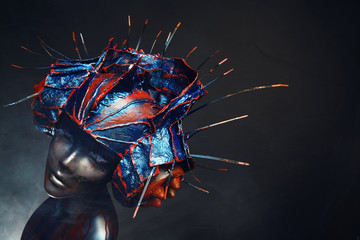 Mannequin in creative head wear with spikes