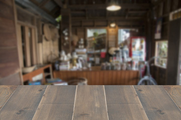 Perspective wooden with abstract blur old coffee shop and cafe interior for background