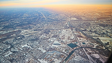 Winter sunset city view from the airplane