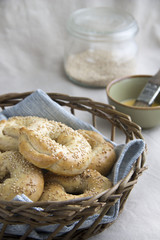 bakery breakfast, bagel or bun in basket on light background