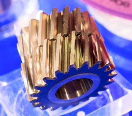 Two gears with cut slanting teeth.