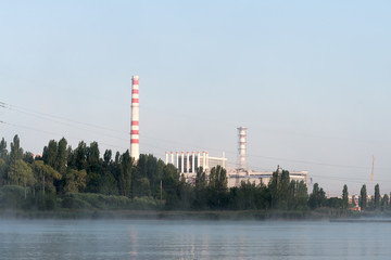 Kursk Nuclear Power Plant reflected in a calm water surface.