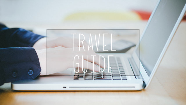 Travel Guide, text over young man typing on laptop at desk
