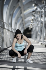 sport woman tired and exhausted breathing and cooling down after running