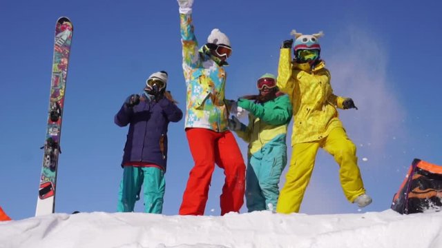 Girls dance and have fun at top of mountain