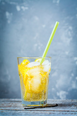 Cold vanilla lemonade with lemons and ice.