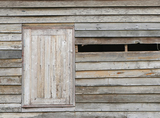 Old abandoned wooden house with broken