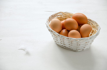 Basket with beige eggs