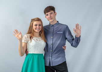 Girl and boy posing in the studio for advertising