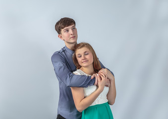 A loving couple posing in the studio