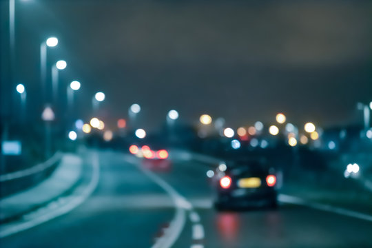 Abstract blurred background.  Car on the road at night
