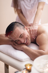 Fototapeta na wymiar young man having a back massage