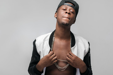 Young african american gangster man. Neglecting, arrogance, swagger, self-assumption. Ghetto,...