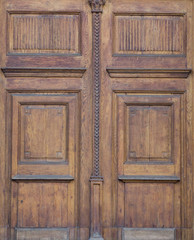 The vintage brown  wooden front door of an old house
