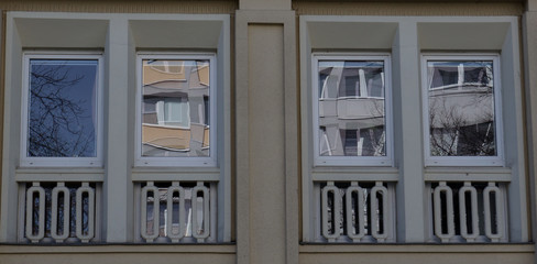 Obraz premium Two Modern front glass windows of an new house