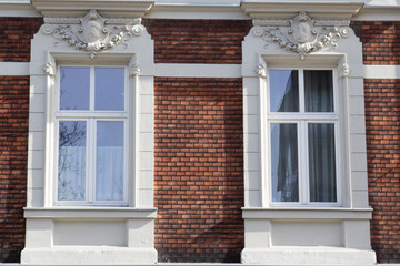 Two vintage front glass windows of an old house