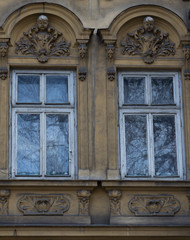 Fototapeta na wymiar Two vintage front glass windows of an old house