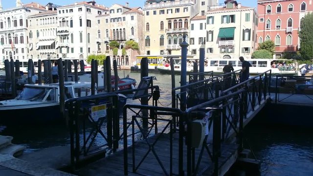 Gondolas wallow moored at the berth in the Grand Canal