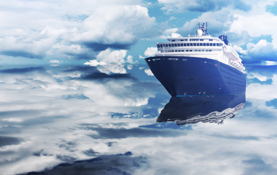 The cruise ship sails between the clouds. Luxury cruise ship floating on the ocean. A large boat for traveling around the world.