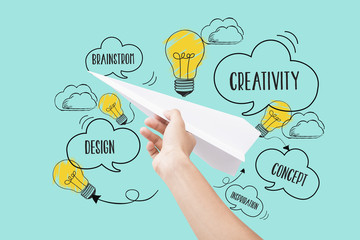 Hand holding paper plane. concept new idea with innovation and creativity.