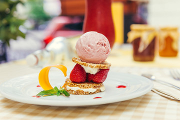 Strawberry ice cream dish with fresh cookie