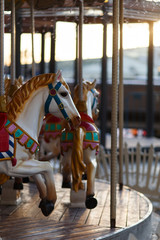 Fototapeta na wymiar Children's carousel with horses outdoor