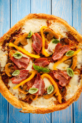 Pizza with beacon, mushrooms and pepper