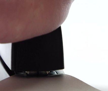 Office stapler stapling a piece of paper with a staple