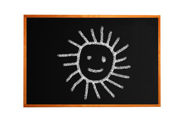 Blackboard with drawing smiling sun isolated on white