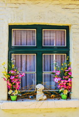 Fototapeta na wymiar Beautiful window in the old house of small European city
