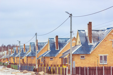 Obraz premium Street in the village with the same houses