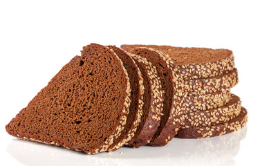 slices of black bread with sesame seeds isolated on white background