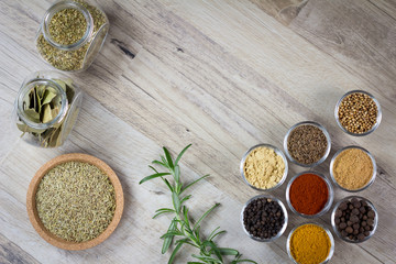Various colorful spices on wooden table. closeup. place for typography