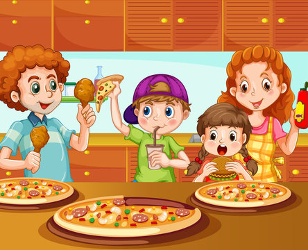 Family having pizza in kitchen