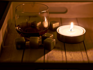 still life with rum and candle