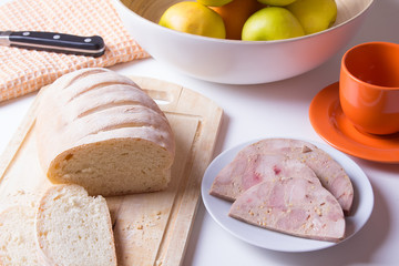 Homemade ham from chicken and homemade white bread. Breakfast. Selective focus.