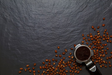 Coffee background - top view. Coffee in a holder and coffee beans