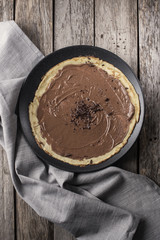 above view of a chocolate crepe on a plate