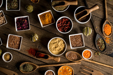 Various of colorful spices on wooden table. place for typography
