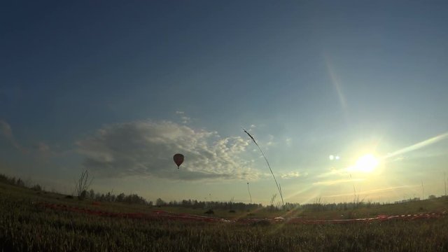Hot air balloon over the field