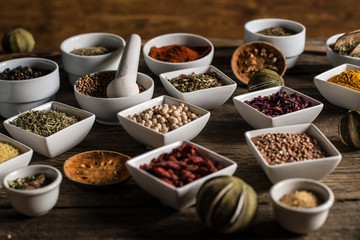 Various of colorful spices on wooden table. place for typography