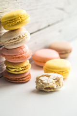 Colorful macaroons on wooden background