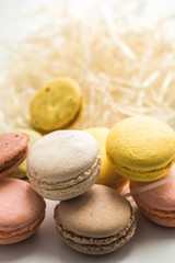Colorful macaroons on wooden background