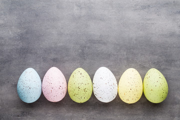 Easter eggs painted in colors on a pattern background.