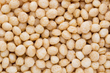 Corn flakes rings on the background.